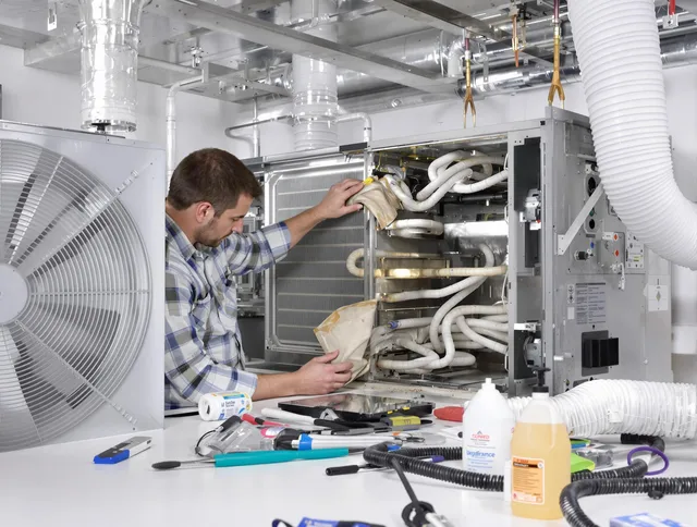 Tyngsborough Air Duct Cleaning specialist performing precision AC coil cleaning in Tyngsborough