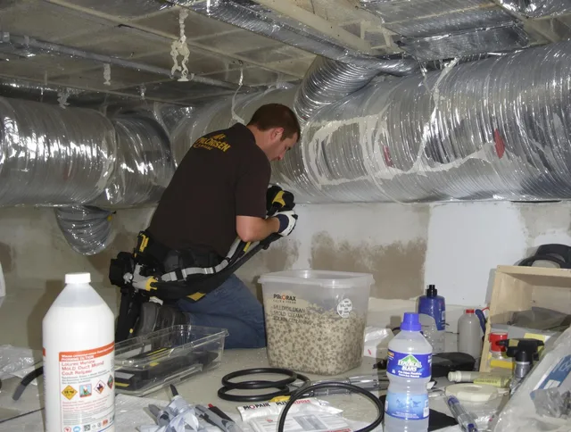Tyngsborough Air Duct Cleaning specialist performing professional mold removal from air ducts in Tyngsborough