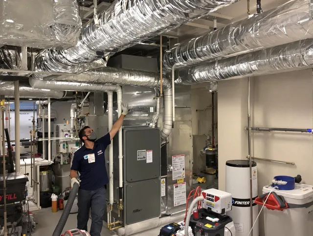Tyngsborough Air Duct Cleaning specialist performing thorough furnace duct cleaning in a Tyngsborough residence