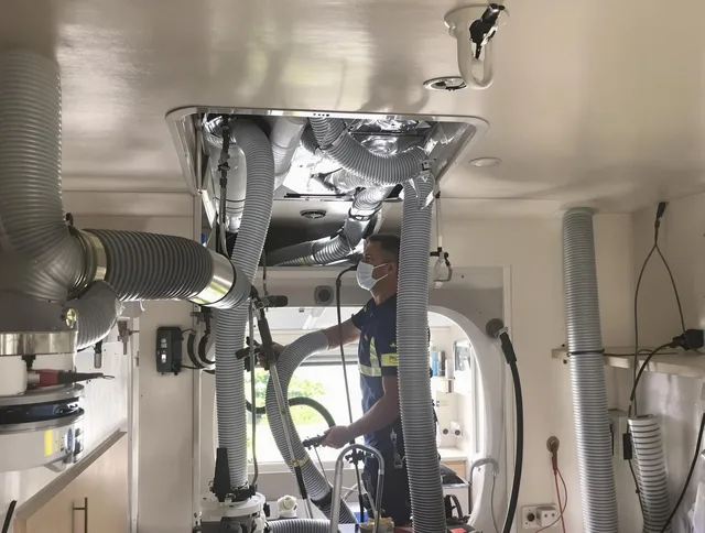 Tyngsborough Air Duct Cleaning specialist performing precise mobile home duct cleaning in Tyngsborough